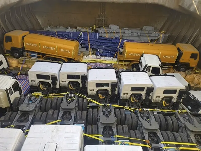 A group of kales trucks parked at the port, waiting for export.