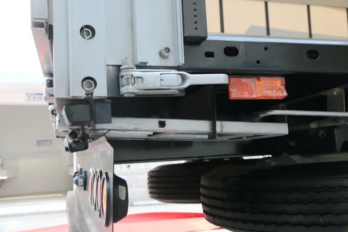 Detail of side curtain tensioner and rear retractable ladder on Kales 13M Curtainsider semi-trailer.