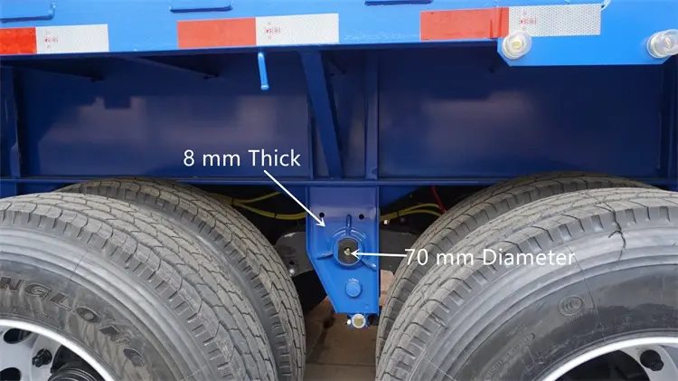 Kales dropside trailer heavy-duty suspension detail: 70mm pin, diagonal bracing reinforcement, and dual tires.